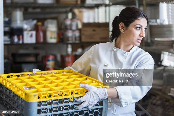 woman working in commercial kitchen - dirty dishes stock pictures, royalty-free photos & images