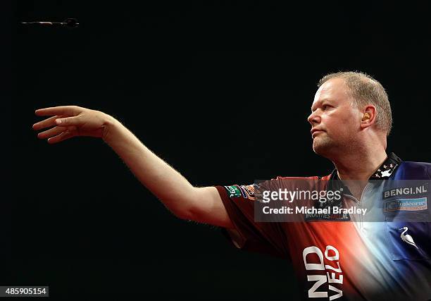 Raymond van Barneveld in action against Adrian Lewis in the final match during the Auckland Darts Masters at The Trusts Arena on August 30, 2015 in...