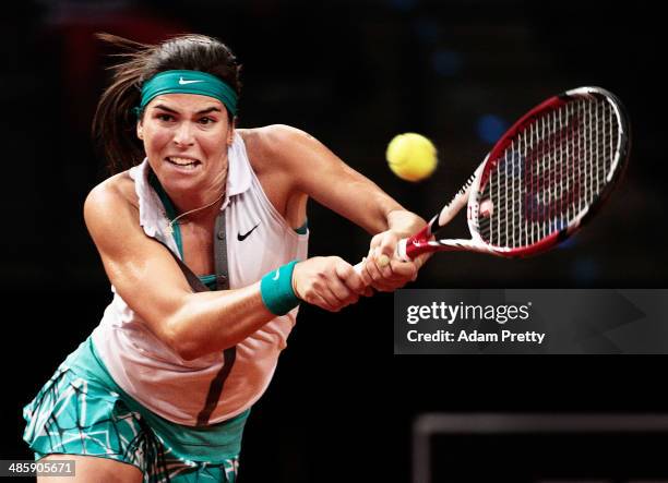 Ajla Tomljanovic of Croatia hits a backhand during her first round match against Mona Barthel of Germany on day one of the Porsche Tennis Grand Prix...
