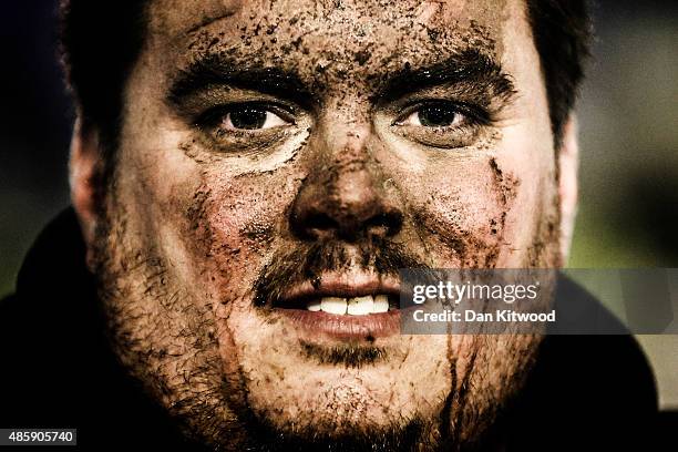 Competitor stands by the track after a Banger race at Foxhall International Raceway on November 09 in Ipswich, England. Banger racing began in the...