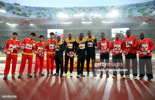 Silver medalists Team China, gold medalists Team Jamaica and bronze medalists Team Canada pose on the podium during the medal ceremony for the Men's...