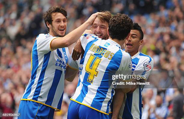 Dale Stephens of Brighton celebrates with team mates Will Buckley, Keith Andrews and Jesse Lingard after opening the scoring during the Sky Bet...
