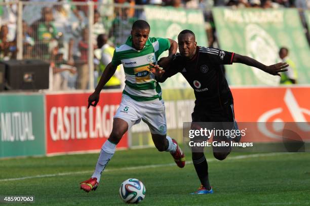 Wandisile Letlabika of Celtics and Mpho Makola of Pirates of Pirates compete during the Absa Premiership match between Bloemfontein Celtic and...