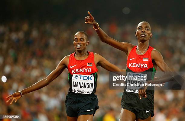 Asbel Kiprop of Kenya crosses the finish line to win gold in the Men's 1500 metres final ahead of Elijah Motonei Manangoi of Kenya during day nine of...