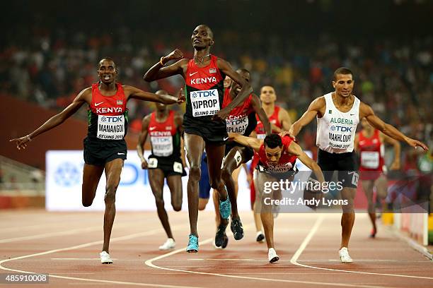 Asbel Kiprop of Kenya crosses the finish line to win gold in the Men's 1500 metres final ahead of Elijah Motonei Manangoi of Kenya and Abdalaati...