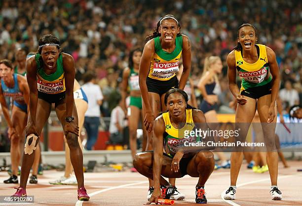 Gold medalists Shericka Jackson of Jamaica, Stephenie Ann McPherson of Jamaica, Novlene Williams-Mills of Jamaica and Christine Day of Jamaica look...