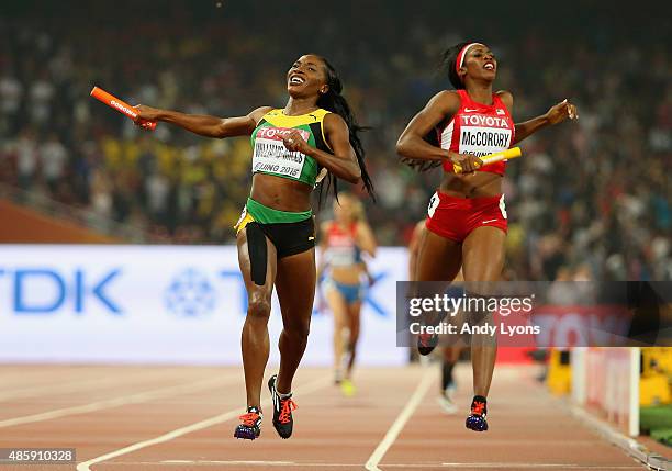 Novlene Williams-Mills of Jamaica crosses the line to win gold ahead of Francena McCorory of the United States in the Women's 4x400 Relay Final...