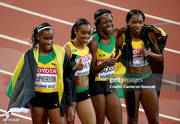 Shericka Jackson of Jamaica, Stephenie Ann McPherson of Jamaica, Novlene Williams-Mills of Jamaica and Christine Day of Jamaica celebrate after...