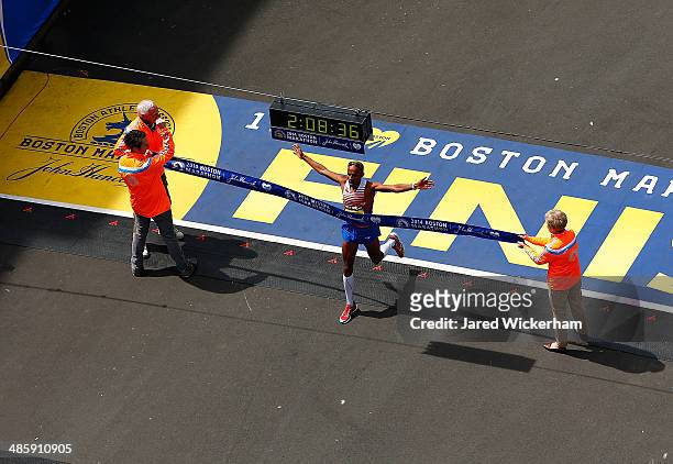 Meb Keflezighi of the United States crosses the finish line in first place to win the 2014 B.A.A. Boston Marathon on April 21, 2014 in Boston,...