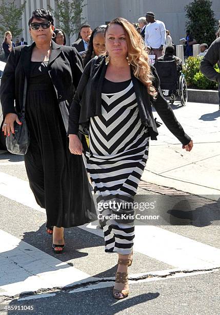 Joyce Hawkins leaves the H. Carl Moultrie 1 Courthouse after it was announced the start of Chris Brown's assault trial is to be pushed back to...