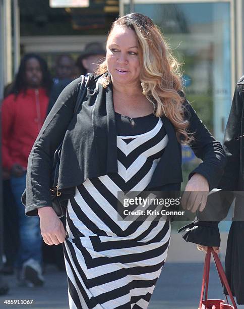 Joyce Hawkins leaves the H. Carl Moultrie 1 Courthouse after it was announced the start of Chris Brown's assault trial is to be pushed back to...