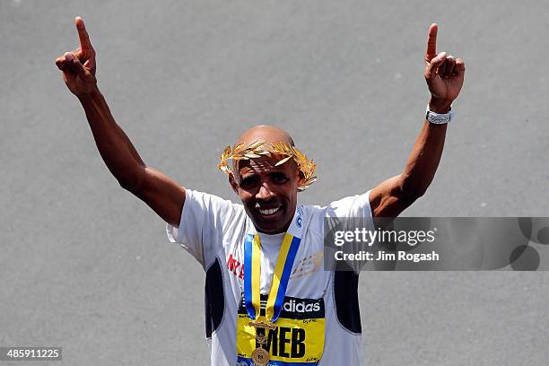 Meb Keflezighi celebrates after winning the 118th Boston Marathon on April 21, 2014 in Boston, Massachusetts.