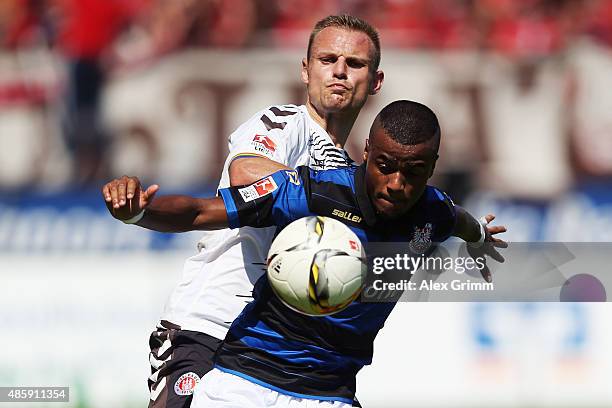 Felipe Pires of Frankfurt is challenged by Bernd Nehrig of St. Pauli during the Second Bundesliga match between FSV Frankfurt and FC St. Pauli at...