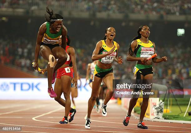 Shericka Jackson of Jamaica, Novlene Williams-Mills of Jamaica and Christine Day of Jamaica celebrate after winning gold in the Women's 4x400 Relay...