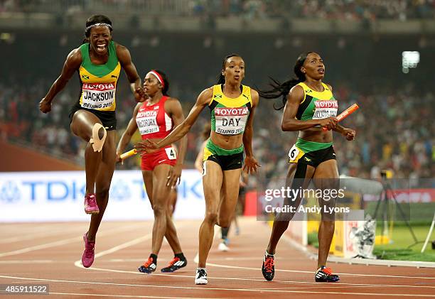 Shericka Jackson of Jamaica, Novlene Williams-Mills of Jamaica and Christine Day of Jamaica celebrate after winning gold in the Women's 4x400 Relay...