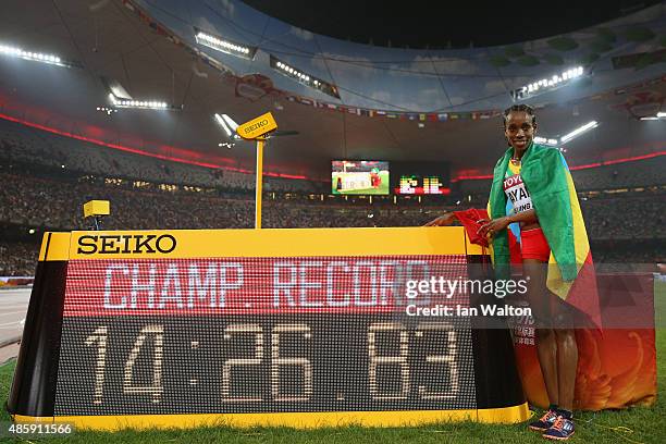 Almaz Ayana of Ethiopia celebrates after winning gold in the Women's 5000 metres final and setting a new Championship Record during day nine of the...