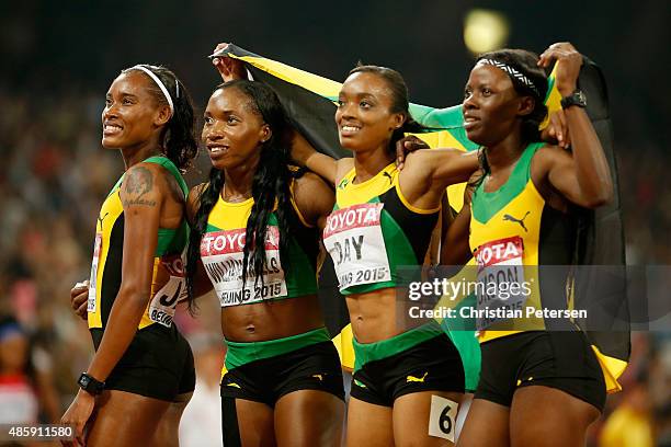 Shericka Jackson of Jamaica, Stephenie Ann McPherson of Jamaica, Novlene Williams-Mills of Jamaica and Christine Day of Jamaica celebrate after...