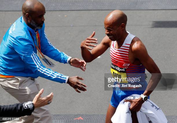 Meb Keflezighi of the United States reacts after winning the 118th Boston Marathon on April 21, 2014 in Boston, Massachusetts.