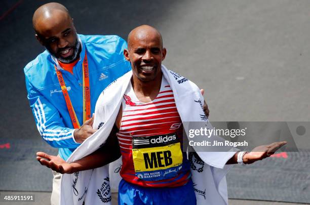 Meb Keflezighi of the United States celebrates after winning the 118th Boston Marathon on April 21, 2014 in Boston, Massachusetts.