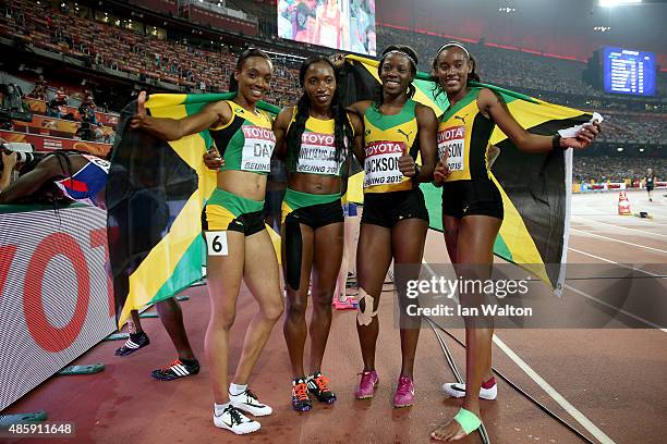 Shericka Jackson of Jamaica, Stephenie Ann McPherson of Jamaica, Novlene Williams-Mills of Jamaica and Christine Day of Jamaica celebrate after...