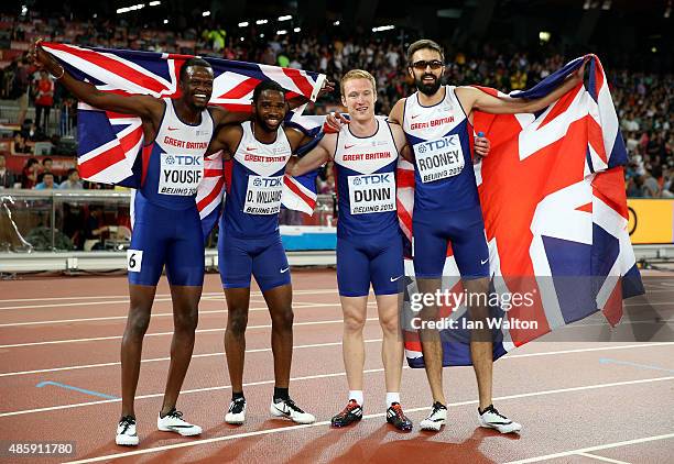 Rabah Yousif of Great Britain, Delanno Williams of Great Britain, Jarryd Dunn of Great Britain and Martyn Rooney of Great Britain celebrate after...