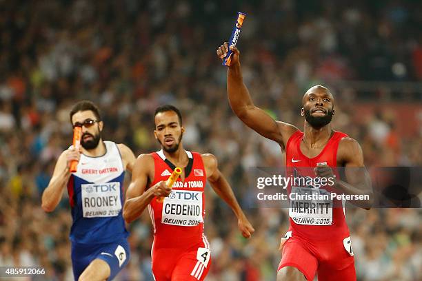 Lashawn Merritt of the United States crosses the line to win gold ahead of Martyn Rooney of Great Britain and Machel Cedenio of Trinidad and Tobago...