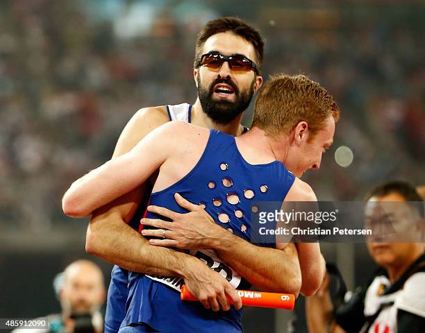 Jarryd Dunn of Great Britain and Martyn Rooney of Great Britain celebrate after winning bronze in the Men's 4x400 Metres Relay final during day nine...