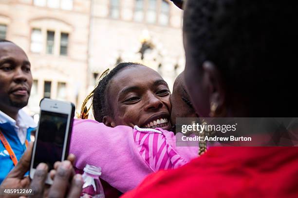 Rita Jeptoo, a Kenya, hugs fans after winning in the women's division of the Boston Marathon on April 21, 2014 in Boston, Massachusetts. Today marks...