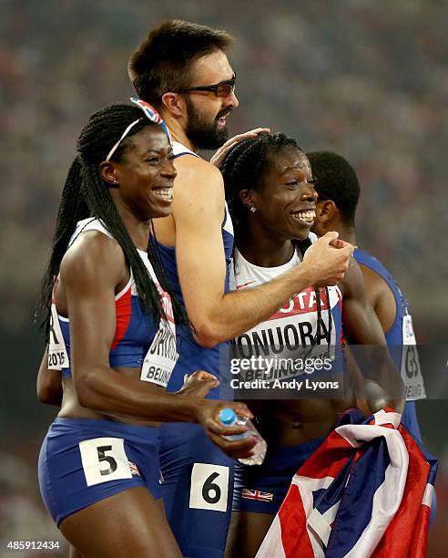 Martyn Rooney of Great Britain, Christine Ohuruogu of Great Britain and Anyika Onuora of Great Britain celebrate after all winning bronze in the...