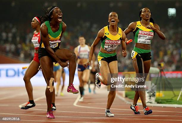 Shericka Jackson of Jamaica, Novlene Williams-Mills of Jamaica and Christine Day of Jamaica celebrate after winning gold in the Women's 4x400 Relay...