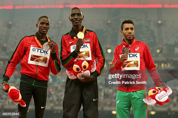 Silver medalist Elijah Motonei Manangoi of Kenya, gold medalist Asbel Kiprop of Kenya and bronze medalist Abdalaati Iguider of Morocco pose on the...