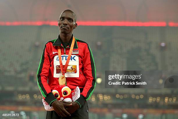 Gold medalist Asbel Kiprop of Kenya poses on the podium during the medal ceremony for the Men's 1500 metres final during day nine of the 15th IAAF...