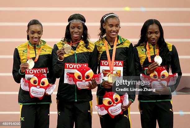 Gold medalists Shericka Jackson of Jamaica, Stephenie Ann McPherson of Jamaica, Novlene Williams-Mills of Jamaica and Christine Day of Jamaica pose...