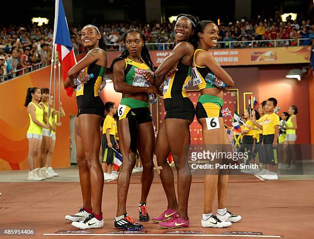 Shericka Jackson of Jamaica, Stephenie Ann McPherson of Jamaica, Novlene Williams-Mills of Jamaica and Christine Day of Jamaica pose prior to the...
