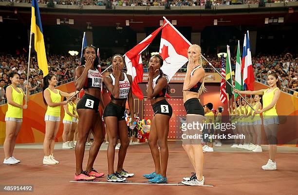 Carline Muir of Canada, Aiyanna Stiverne of Canada, Sage Watson of Canada and Audrey Jean-Baptiste of Canada pose prior to the Women's 4x400 Relay...