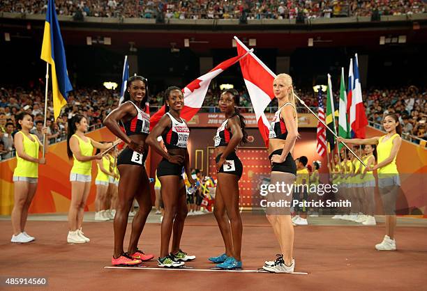 Carline Muir of Canada, Aiyanna Stiverne of Canada, Sage Watson of Canada and Audrey Jean-Baptiste of Canada pose prior to the Women's 4x400 Relay...