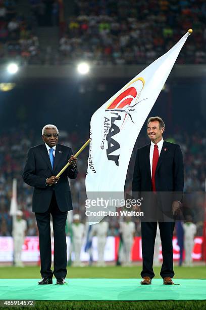 President Lamine Diack hands over the IAAF flag during the closing ceremony during day nine of the 15th IAAF World Athletics Championships Beijing...