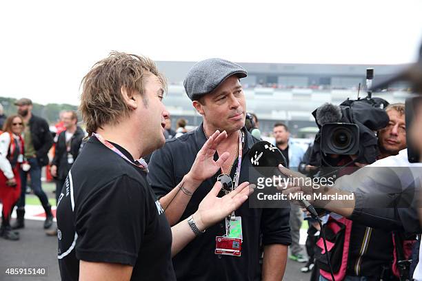 Brad Pitt and Director Mark Neale attend the MotoGP British Grand Prix race at Silverstone ahead of the release of documentary Hitting The Apex. Pitt...