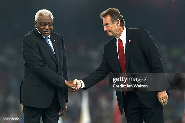 President Lamine Diack greets President of UK athletics Lynn Davies during the closing ceremony during day nine of the 15th IAAF World Athletics...