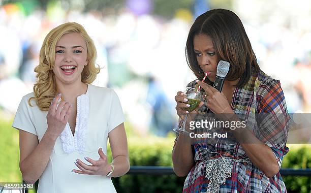 First lady Michelle Obama drinks a healthy milkshack with comedian Peyton List from the comedy series Jessie during the annual White House Easter Egg...