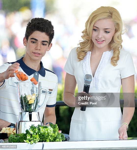 Comedian Peyton List and Cameron Boyce from the comedy series Jessie makes a healthy drink with during the annual White House Easter Egg Roll on the...