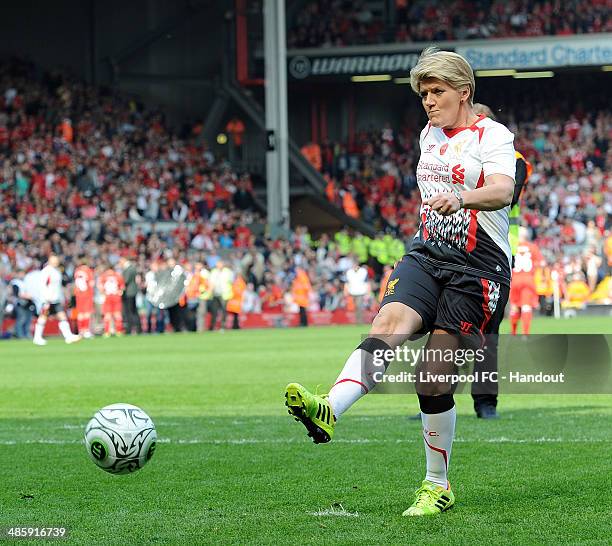 In this handout image provided by Liverpool FC, Clare Balding of Liverpool takes a penalty during the celebration of the 96 Charity Match at Anfield...