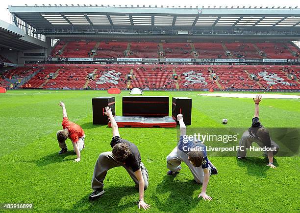 In this handout image provided by Liverpool FC, Free Runners performers before the celebration of the 96 Charity Match at Anfield on April 21, 2014...