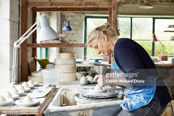 potter throwing a lemon squeezer - potter's wheel stock pictures, royalty-free photos & images
