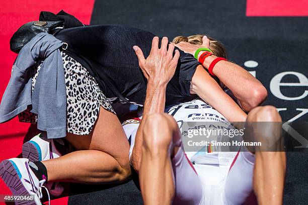 Jan Frodeno of Germany celebrates winning with Emma Snowsill after competing in the Ironman 70.3 World Championship Zell am See Kaprun on August 30,...