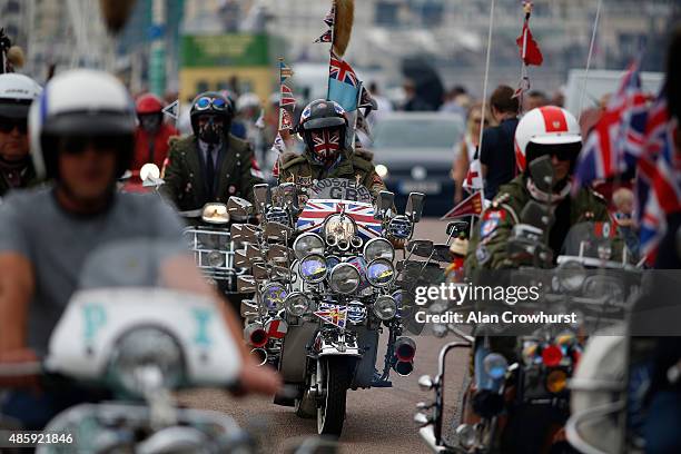 Mods make their way to Eastbourne on their ride out during the Brighton Mod Weekender where mods and their scooters gather on the annual bank holiday...