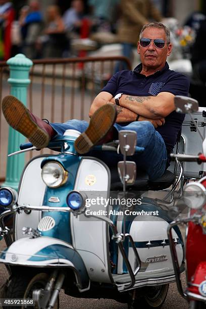 Mods relax during the Brighton Mod Weekender where mods and their scooters gather on the annual bank holiday weekend event on August 30, 2015 in...