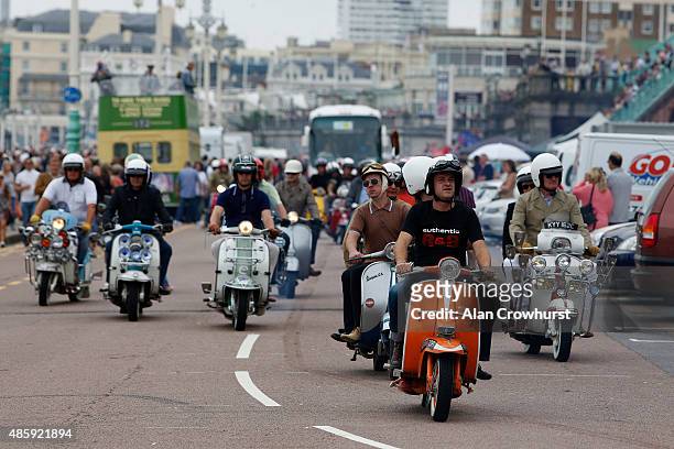 Mods make their way to Eastbourne on their ride out during the Brighton Mod Weekender where mods and their scooters gather on the annual bank holiday...