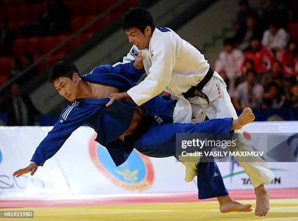 Japan's Takanori Nagase competes with South Korea's Lee Seungsu during the men's team gold medal match at the Judo World Championships in Astana on...