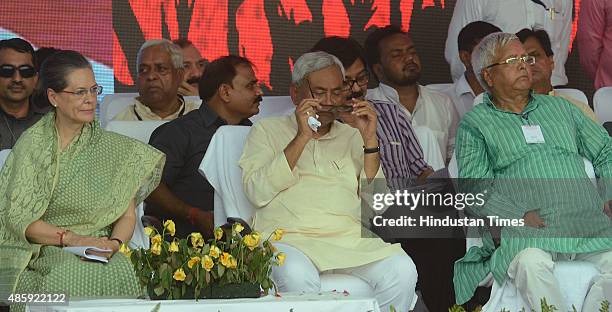 Congress President Sonia Gandhi with Bihar Chief Minister Nitish Kumar and RJD Chief Lalu Prasad during the Swabhiman rally at Gandhi Maidan, on...